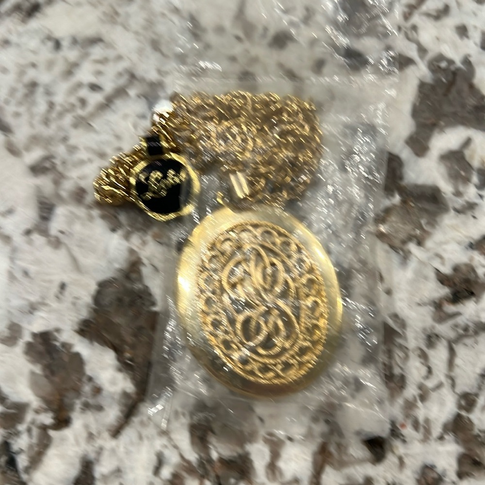 Locket necklace brand new with tags 🏷️ gold in color Opening Locket